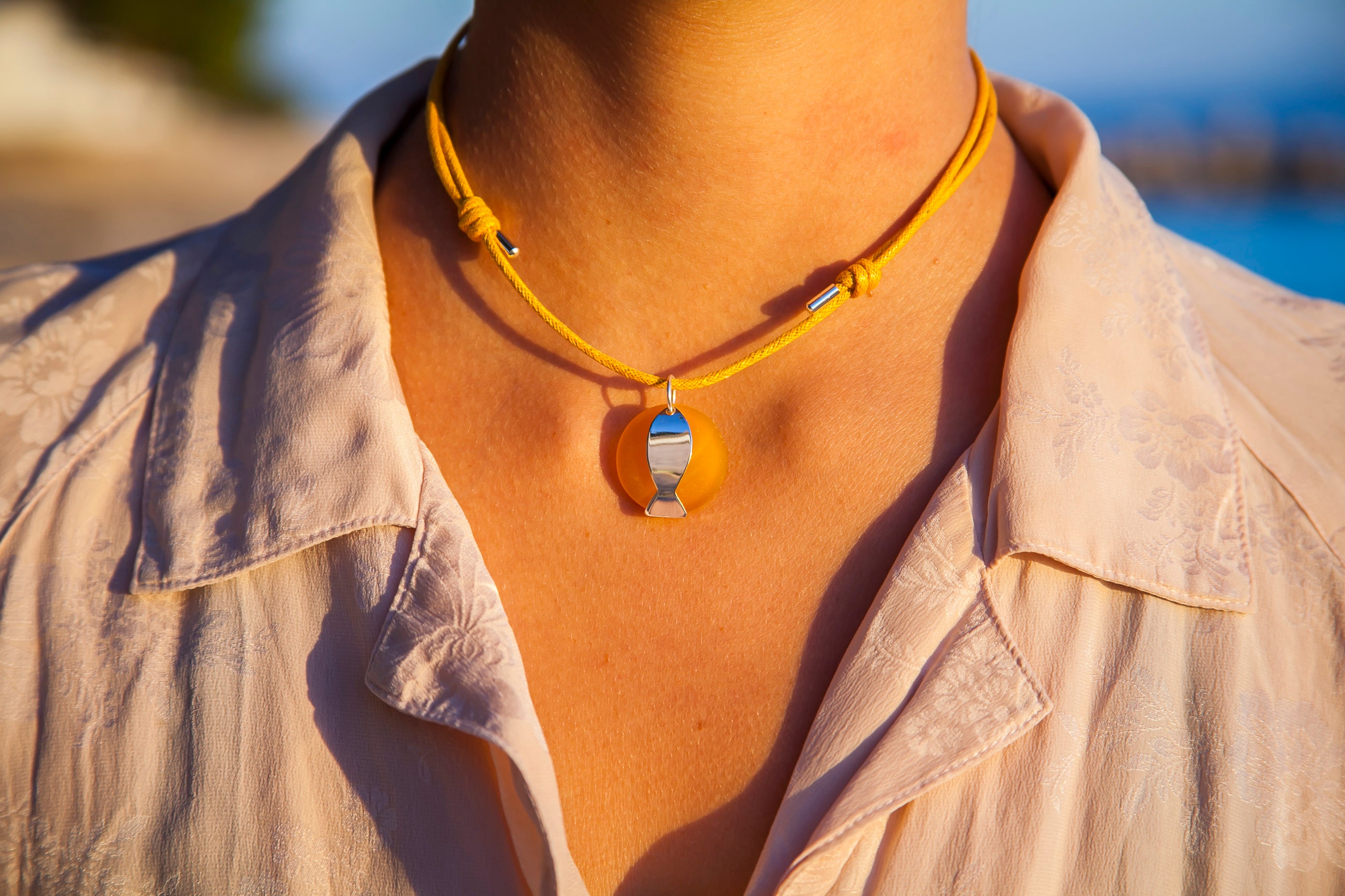 Round beach glass fish necklace